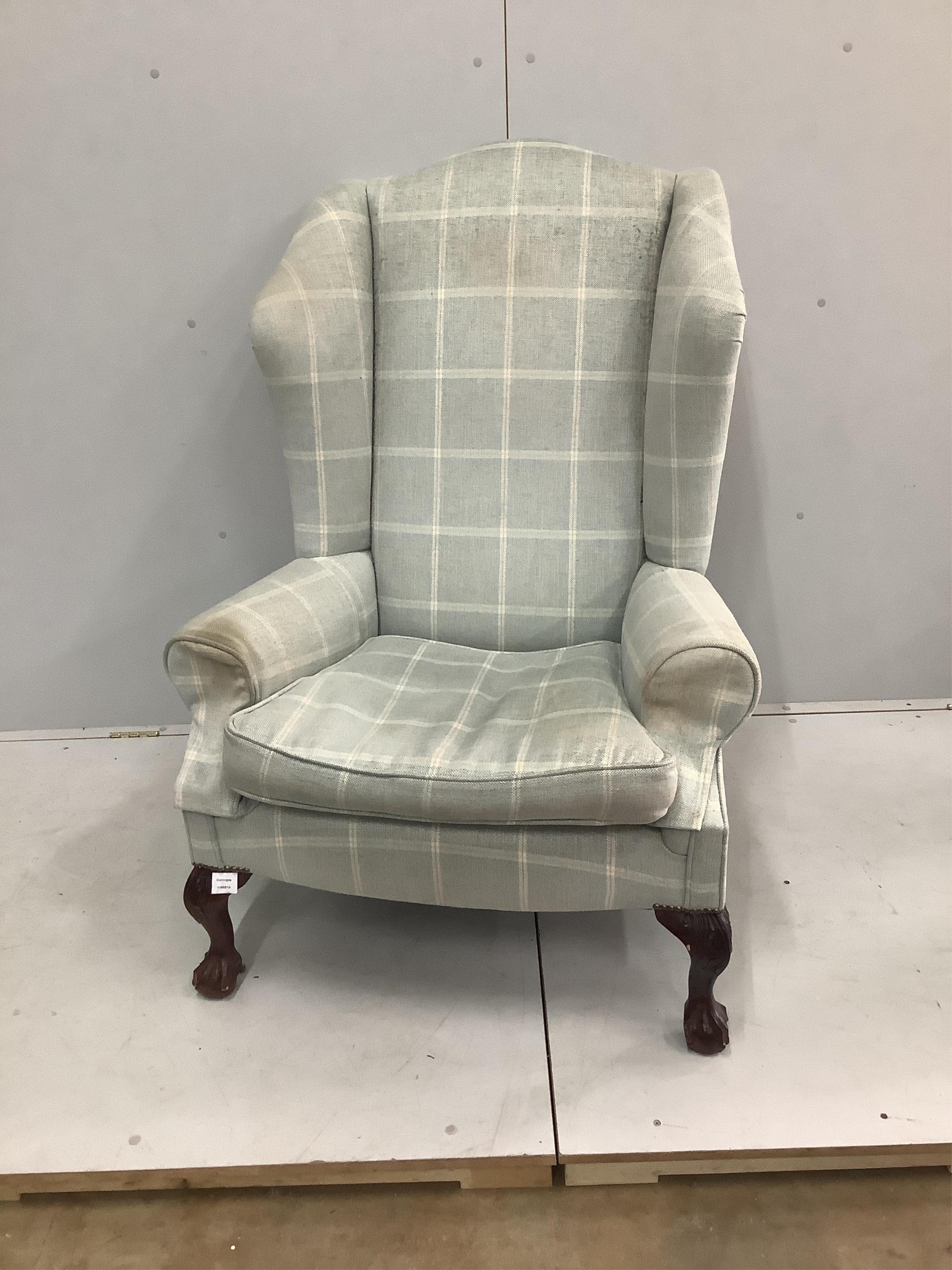 A George I style upholstered wingback armchair, by George Smith, width 79cm, depth 76cm, height 120cm. Condition - fair